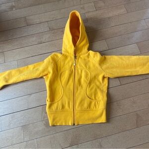 Bold mustard yellow Lululemon sweatshirt